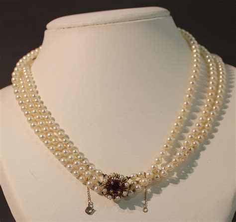 collier perle d'or.